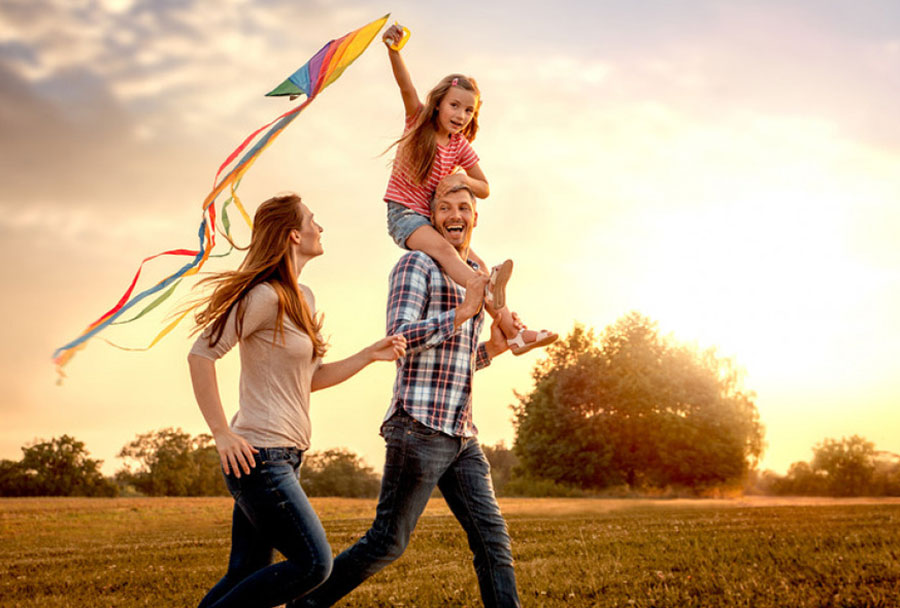 happy family flying a kite